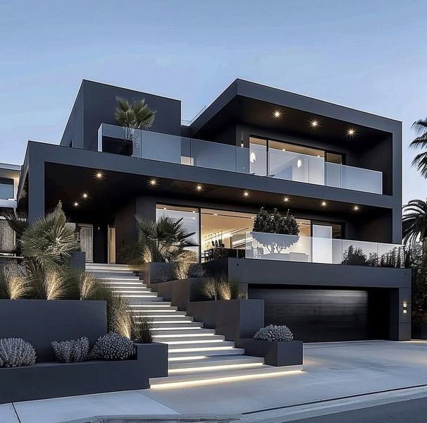 A modern house featuring large windows that let in plenty of natural light, with a sleek and stylish design